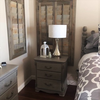 Reclaimed wood in room with plantation shutters